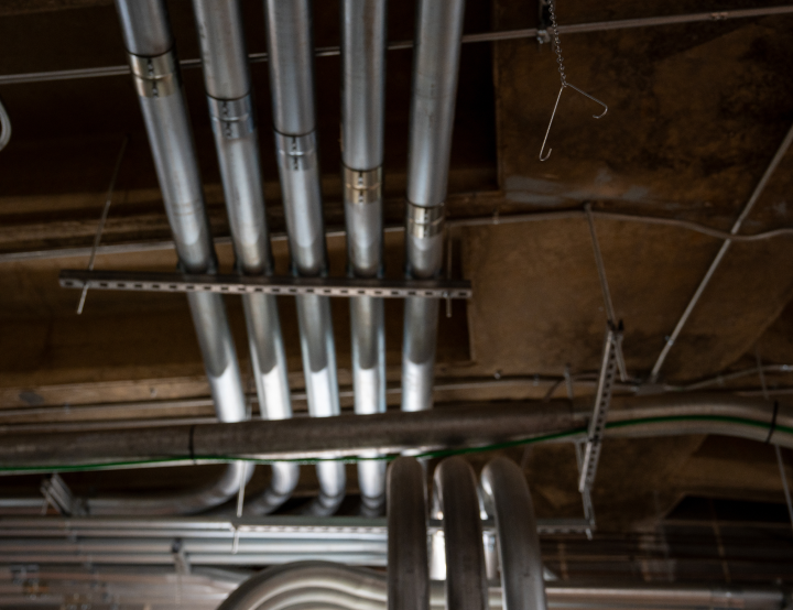 ou_convocation_carousel-2 Parallel conduit runs mounted on strut channel above the ceiling at the Ohio University Convocation Center